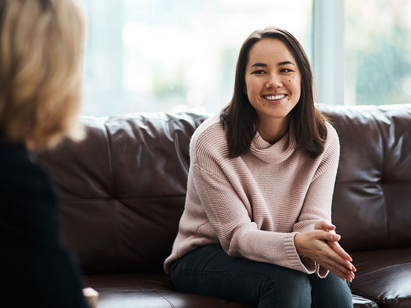 Woman sitting down talking