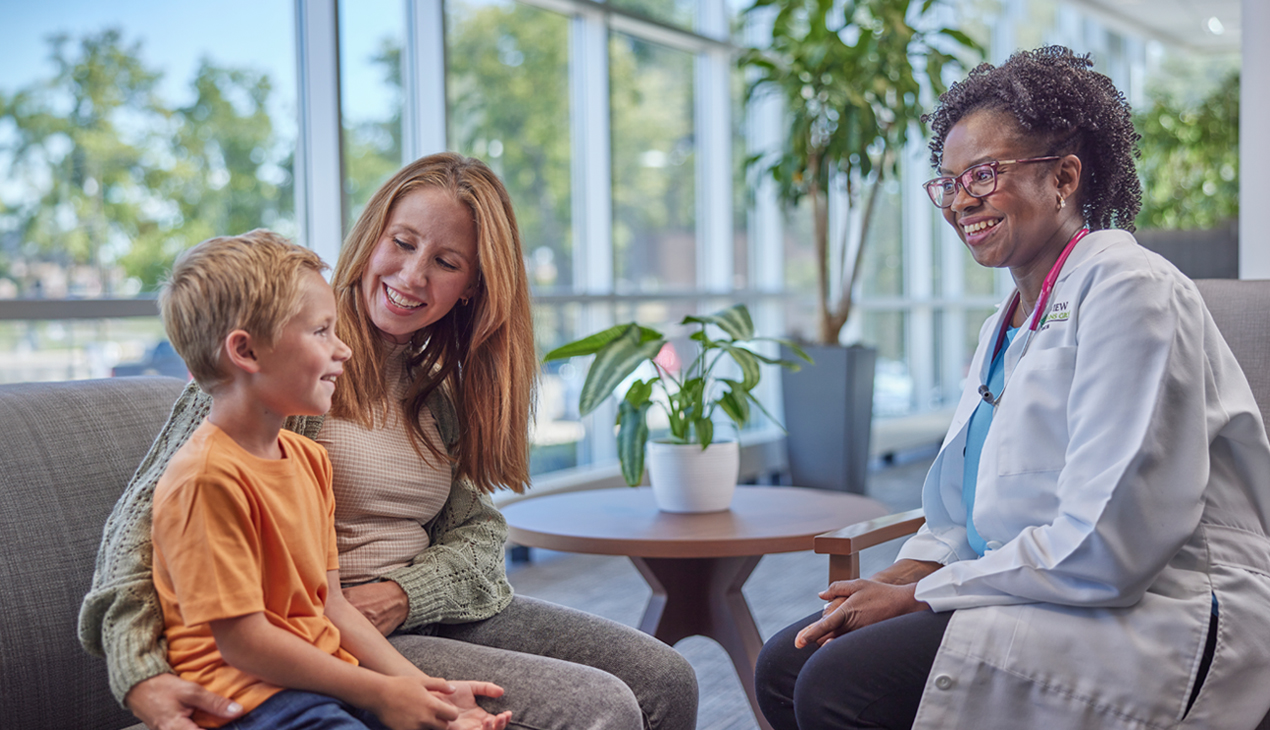 Physician talking with mother and son