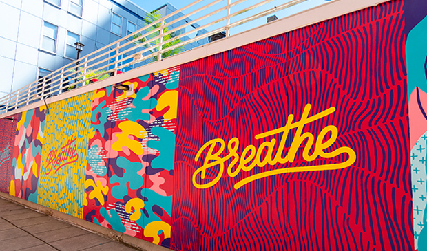 Colorful mural with Breathe written on it