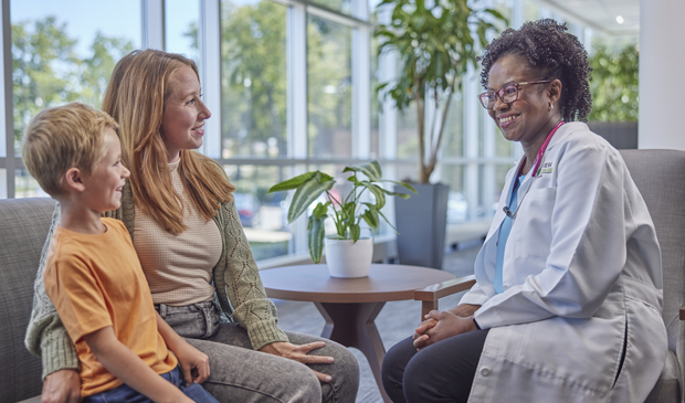 Mother and son talking to provider