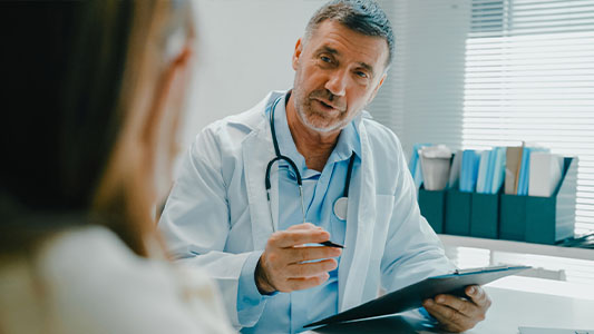 Doctor talking with patient