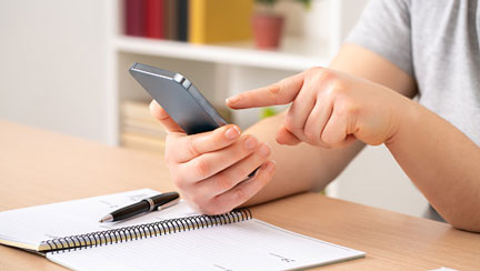 person typing on a phone