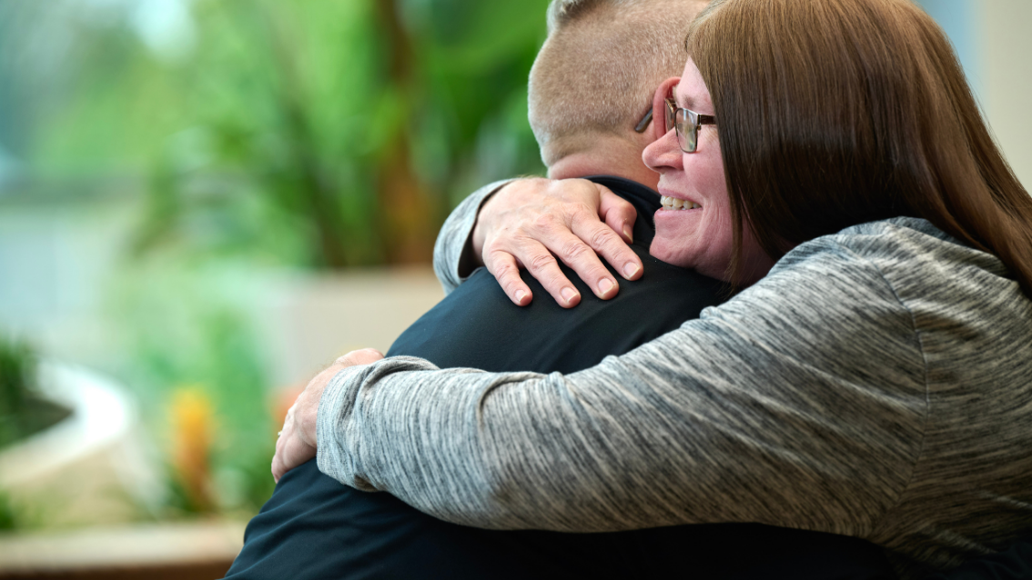 Two people hugging