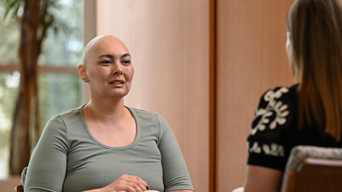 Woman cancer patient meeting with provider
