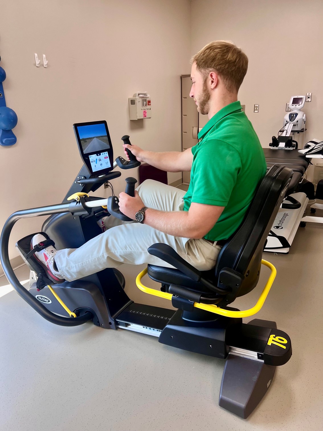 Patient utilizing cross training machine