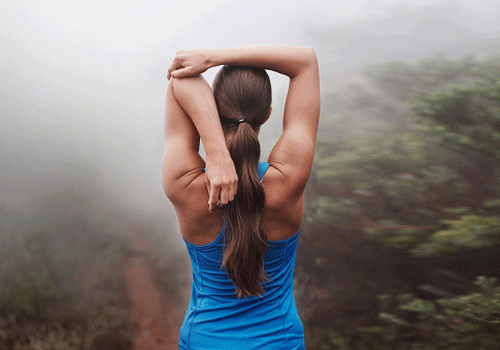 Woman stretching outdoors