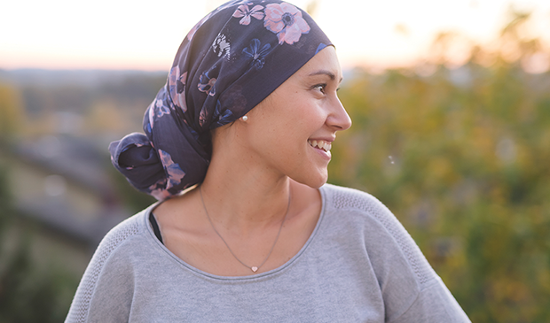 Woman wearing headscarf smiling 