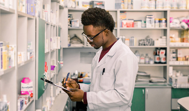 Pharmacist taking inventory